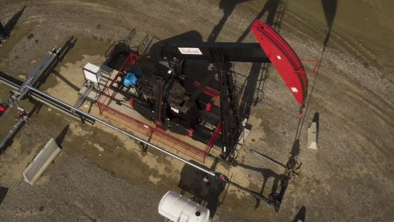 Oil pumpjack and pipeline equipment at onshore wellsite